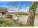 Scenic river view featuring an outdoor deck area, trees, and serene waterfront scenery of this property at 2230 E 75Th St, Indianapolis, IN 46240