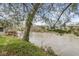 Waterfront view from a deck, overlooking a serene river with lush greenery, highlighting an outdoor living space at 2230 E 75Th St, Indianapolis, IN 46240