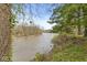 Picturesque river view highlighting lush greenery and a bridge in the distance, emphasizing the tranquil setting at 2230 E 75Th St, Indianapolis, IN 46240