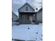 Charming gray house with wood siding and snowy front yard at 2357 Southeastern Ave, Indianapolis, IN 46201