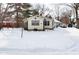 Quaint ranch home with snow covered yard at 2515 Fairfax Rd, Indianapolis, IN 46227