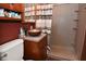 Updated bathroom with copper sink, wood vanity, and a large shower at 2515 Fairfax Rd, Indianapolis, IN 46227