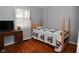 Small bedroom with hardwood floors and antique vanity at 2515 Fairfax Rd, Indianapolis, IN 46227