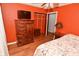 Cozy bedroom with wood floors and built-in shelving at 2515 Fairfax Rd, Indianapolis, IN 46227
