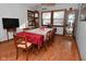 Spacious dining room with hardwood floors and a large table for entertaining at 2515 Fairfax Rd, Indianapolis, IN 46227