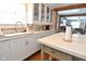 Updated kitchen with white cabinets and granite countertops at 2515 Fairfax Rd, Indianapolis, IN 46227