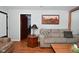 Living room with hardwood floors and a comfortable couch at 2515 Fairfax Rd, Indianapolis, IN 46227