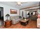 Open living room with hardwood floors, view of kitchen at 2515 Fairfax Rd, Indianapolis, IN 46227