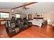 Main bedroom with sitting area, and two leather recliners, and a wood-burning stove at 2515 Fairfax Rd, Indianapolis, IN 46227