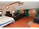 Large main bedroom with a sitting area, fireplace, and plenty of natural light at 2515 Fairfax Rd, Indianapolis, IN 46227