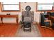 Home office with wood-burning stove, brick hearth, and ample workspace at 2515 Fairfax Rd, Indianapolis, IN 46227