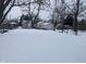 Snowy backyard with a view of neighboring houses at 3050 N Gladstone Ave, Indianapolis, IN 46218