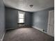 Simple bedroom with grey walls and carpeted floor at 3050 N Gladstone Ave, Indianapolis, IN 46218