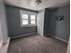Simple bedroom with grey walls and carpeted floor at 3050 N Gladstone Ave, Indianapolis, IN 46218