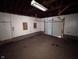 Unfinished garage with concrete floor at 3050 N Gladstone Ave, Indianapolis, IN 46218
