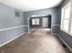 Spacious living room with grey walls and carpeted floor at 3050 N Gladstone Ave, Indianapolis, IN 46218