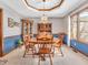 Dining room features hardwood floors and a wooden table with chairs at 310 Vista Ct, Plainfield, IN 46168