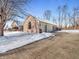 Brick house with attached garage and snow covered driveway at 310 Vista Ct, Plainfield, IN 46168