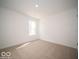 Bright, empty bedroom with neutral carpet, and a window letting in natural light at 3201 W Keepsake Ln, Monrovia, IN 46157