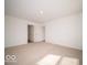Bedroom with neutral colored carpet and two closets at 3201 W Keepsake Ln, Monrovia, IN 46157