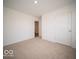 Bright bedroom featuring neutral carpeting and a closet at 3201 W Keepsake Ln, Monrovia, IN 46157