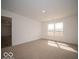 Bedroom features neutral carpet and natural light from large window at 3201 W Keepsake Ln, Monrovia, IN 46157
