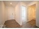Bright hallway featuring luxury vinyl plank flooring and entryways to other rooms at 3201 W Keepsake Ln, Monrovia, IN 46157