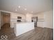 Modern kitchen featuring stainless steel appliances, white cabinets, and a center island at 3201 W Keepsake Ln, Monrovia, IN 46157