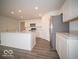 Modern kitchen with gray stainless steel refrigerator and large island with bar seating at 3201 W Keepsake Ln, Monrovia, IN 46157