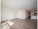 Living room with wood floors, light paint, and recessed lights, open to kitchen at 3201 W Keepsake Ln, Monrovia, IN 46157