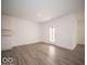 Living room features light wood flooring, and a door to the backyard at 3201 W Keepsake Ln, Monrovia, IN 46157