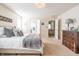 Bright bedroom with a king-size bed and ensuite bathroom at 3633 Newhouse Pl, Greenwood, IN 46143