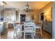 Bright dining area features a wooden table with seating and hardwood floors at 3633 Newhouse Pl, Greenwood, IN 46143