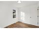 Well-lit bedroom with hardwood floors, and closets with white doors at 3929 E 30Th St, Indianapolis, IN 46218