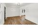 Open living room with hardwood floors, built-in shelves, and an archway at 3929 E 30Th St, Indianapolis, IN 46218