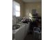 A laundry room shows a washer and dryer, as well as storage shelves and an electrical panel at 3951 N Pasadena St, Indianapolis, IN 46226
