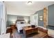 Cozy bedroom with hardwood floors and exposed brick wall at 4702 Michigan Rd, Indianapolis, IN 46228