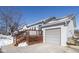 Exterior view of the attached garage and wooden deck at 4759 Ohio St, Clayton, IN 46118