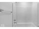 Bathroom features a white bathtub, shower, and towel rack against a clean white wall at 4767 E Shadowbrook Dr, Camby, IN 46113