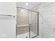 Modern bathroom with a tiled shower, glass door, and chrome hardware at 4767 E Shadowbrook Dr, Camby, IN 46113