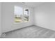 Bright empty bedroom featuring carpet, a window, and neutral walls at 4767 E Shadowbrook Dr, Camby, IN 46113