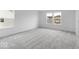 A bright bedroom featuring neutral carpet and natural light from multiple windows at 4767 E Shadowbrook Dr, Camby, IN 46113