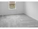 Bedroom features neutral carpet, white walls, and a window to let in natural light at 4767 E Shadowbrook Dr, Camby, IN 46113