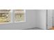 A bedroom with white walls, a large window, and plush carpet at 4767 E Shadowbrook Dr, Camby, IN 46113