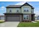 Beautiful two-story home features a brick and siding exterior, a two-car garage, and a well-manicured lawn at 4767 E Shadowbrook Dr, Camby, IN 46113