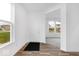 Bright foyer featuring hardwood floors, natural light, and a view of the front yard at 4767 E Shadowbrook Dr, Camby, IN 46113
