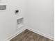 Laundry hook-ups feature wooden-look flooring and white walls at 4767 E Shadowbrook Dr, Camby, IN 46113