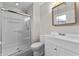 Clean bathroom with a shower, toilet and vanity at 5102 Guion Rd, Indianapolis, IN 46254