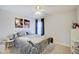 Cozy bedroom with a metal bed frame and window at 5230 Berkshire South Blvd, Greenwood, IN 46142