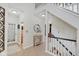 Spacious entryway with a staircase and view into a well-lit living area at 5230 Berkshire South Blvd, Greenwood, IN 46142